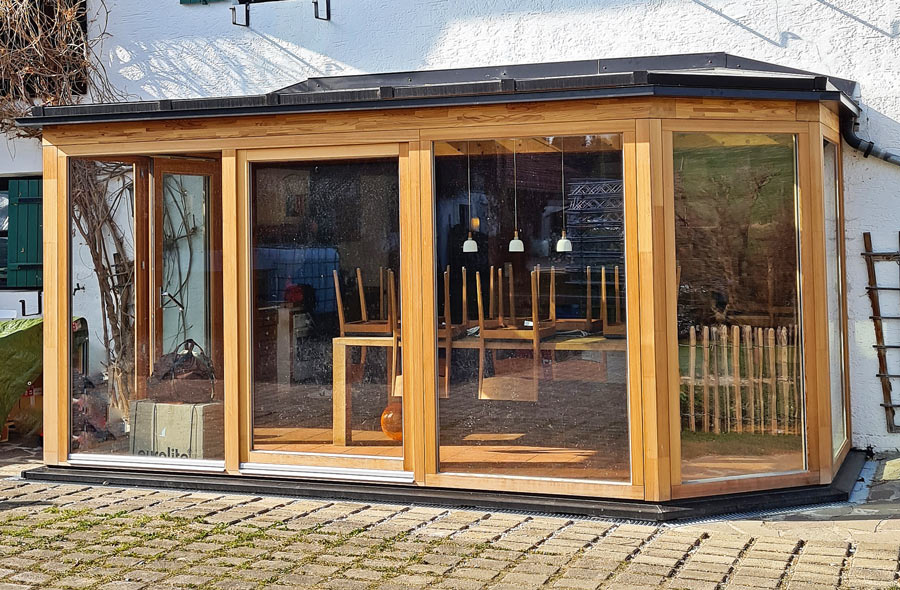 Wohnwintergarten aus Lärchenholz bei Seeshaupt Wohnwintergarten aus Lärchenholz bei Seeshaupt